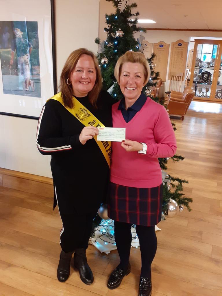 Sharon presenting a cheque to Jane